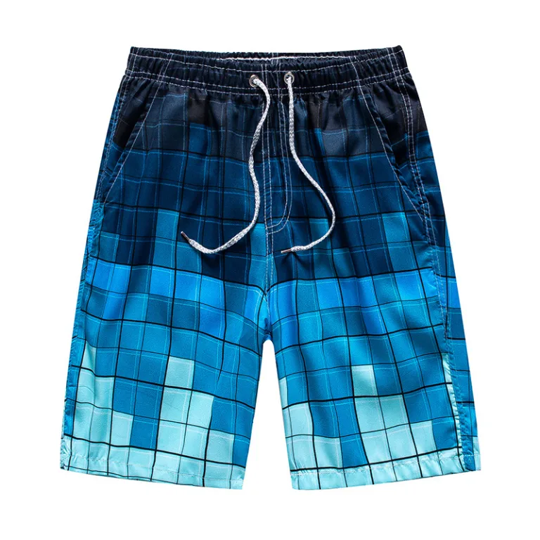 Blue plaid swim trunks isolated on white.