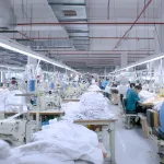 Workers producing custom apparel in Ninghow Apparel factory