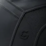 Macro shot of a finished compression sportswear item, highlighting embroidery, print clarity, and flatlock seam detail to demonstrate craftsmanship.
