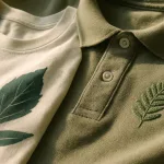 High-resolution detail view of finished embroidery and print decorations demonstrating craftsmanship, vivid color, and smooth handfeel on organic cotton clothing.