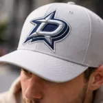 Raised puff embroidery logo featured on baseball cap in use