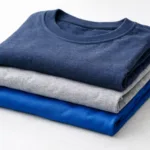A high-quality image showing neatly arranged team t-shirts in various fabric types for clear material comparison.
