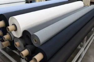Home 43 A close look at high-performance Dri-Fit fabric rolls with a technical, shop-floor feel, showing base materials used in custom shirt production.