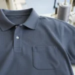 A clean, detailed view of a cotton pocket polo that highlights stitching, fabric texture, and garment finish for uniform buyers.