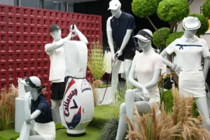 About 5 Mannequins displaying Ninghow Wear golf shirts, skirts, hats, and sportswear