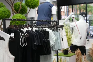 About 6 Golf and sportswear displayed on clothing racks inside the Ninghow Wear store