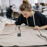 private label clothing quality control sample review in a modern apparel factory