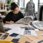 Custom apparel manufacturing planning with fabric swatches and garment patterns